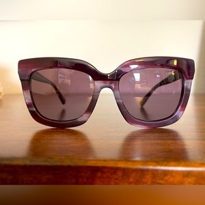 Purple framed Micheal Kors sunglasses